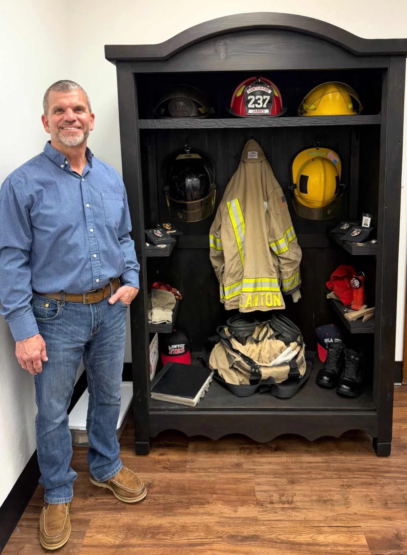 Kent James beside his Fire Service display